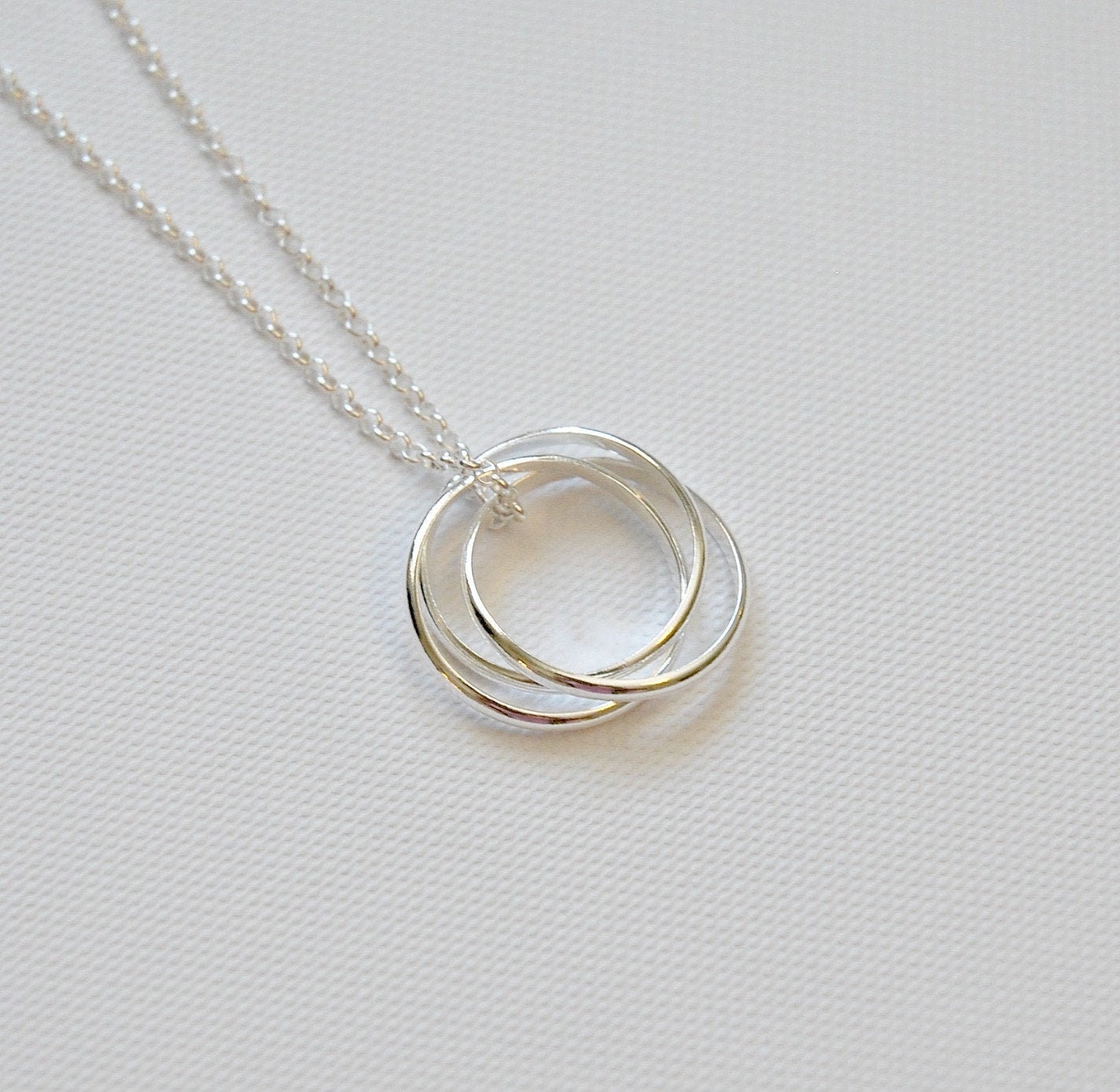 Sterling silver interlocking circle necklace, three circle necklace, nesting circles, entwined eternity rings, past present future