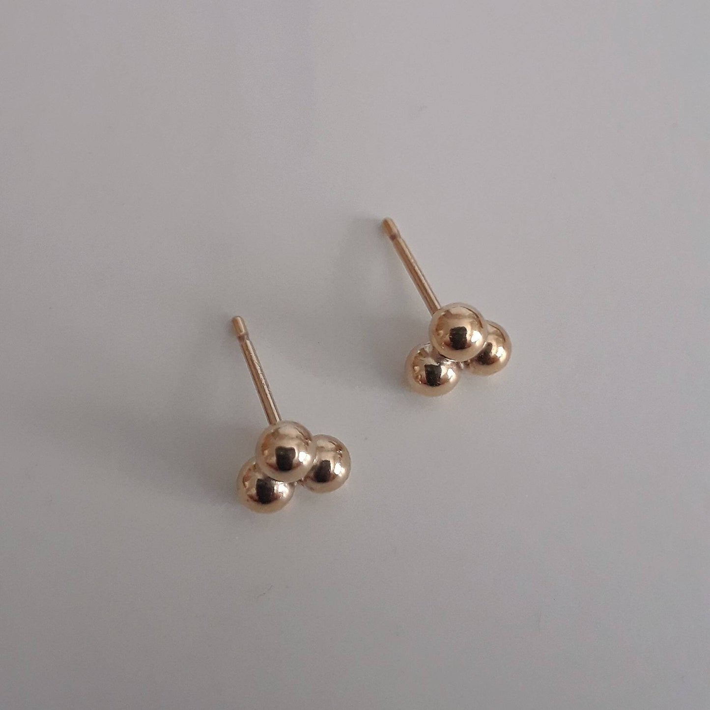 Maika gold triple ball stud earrings