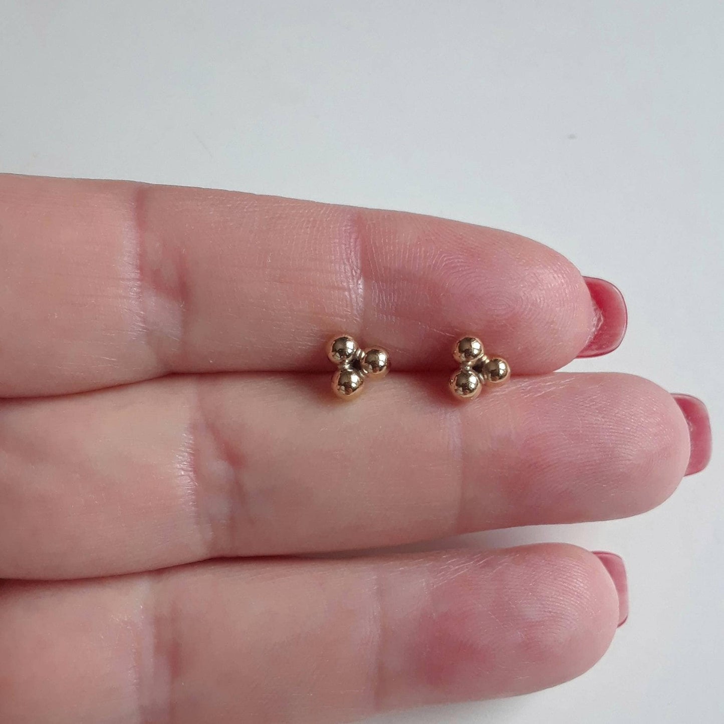 Maika gold triple ball stud earrings