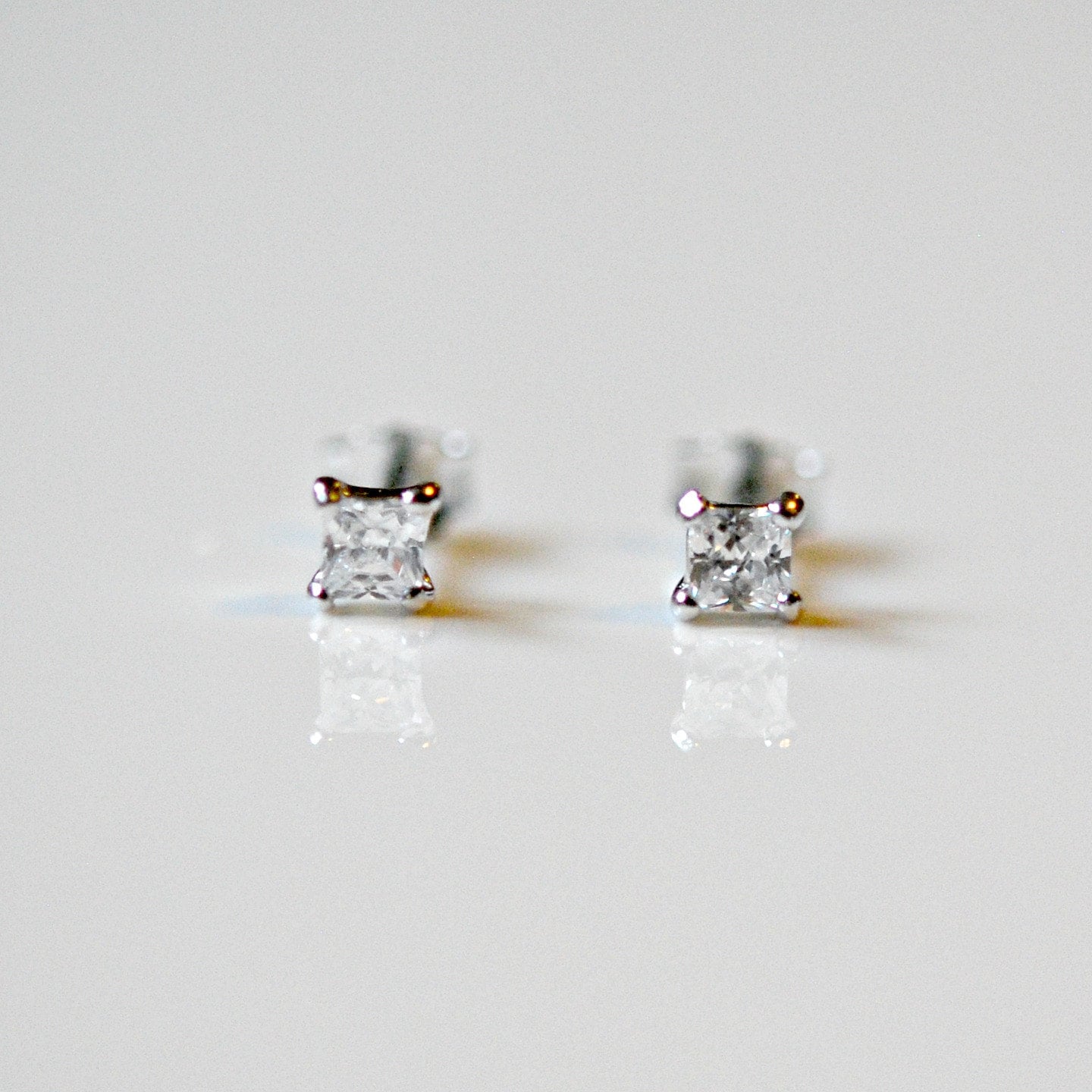 Tiny diamond stud earrings