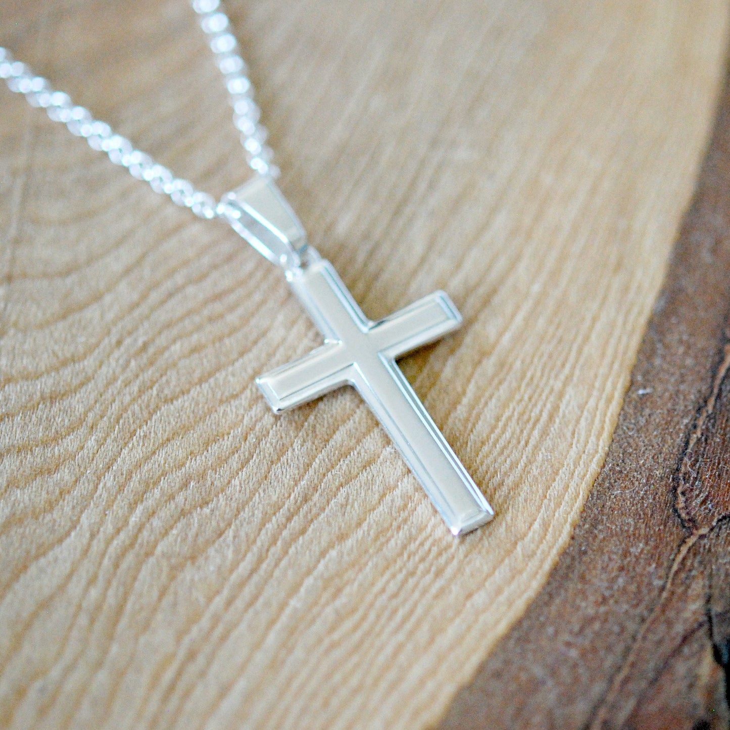 Silver edged cross necklace