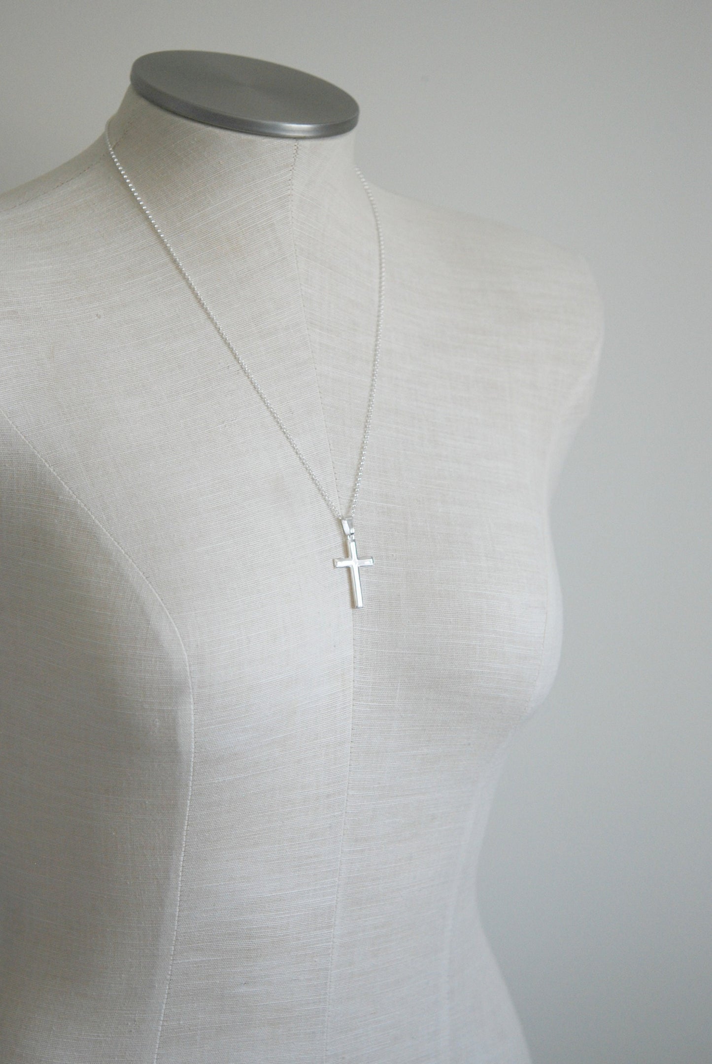 Silver edged cross necklace