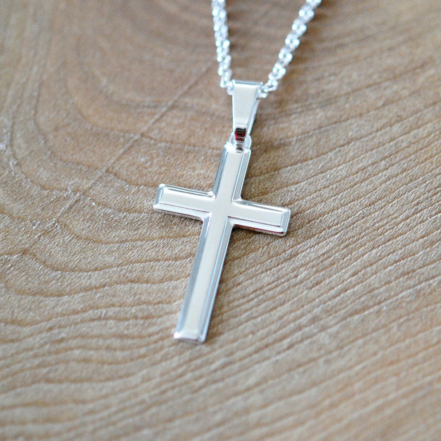 Silver edged cross necklace