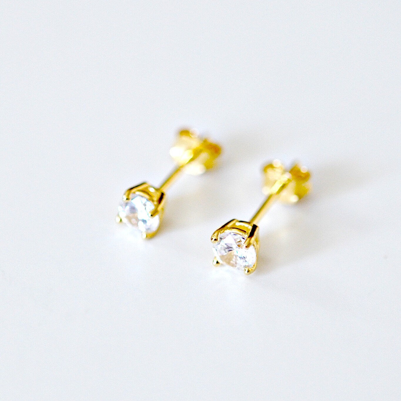 4mm clear cubic zirconia studs - gold