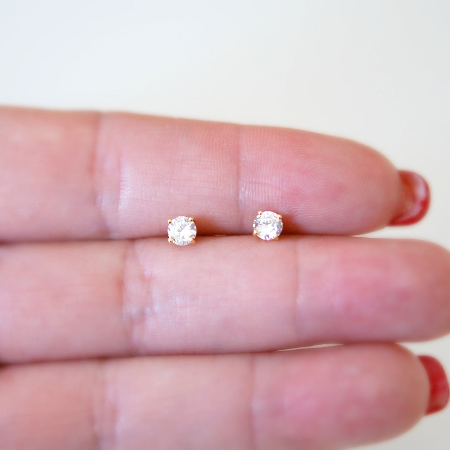 4mm clear cubic zirconia studs - gold