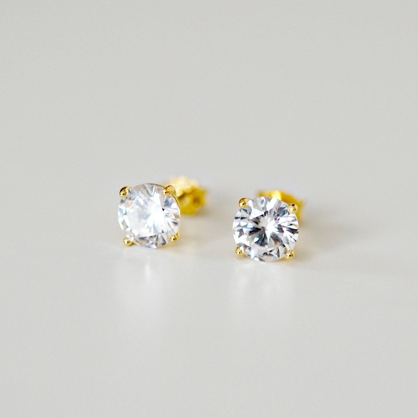 Minka gold cz stud earrings - round or square