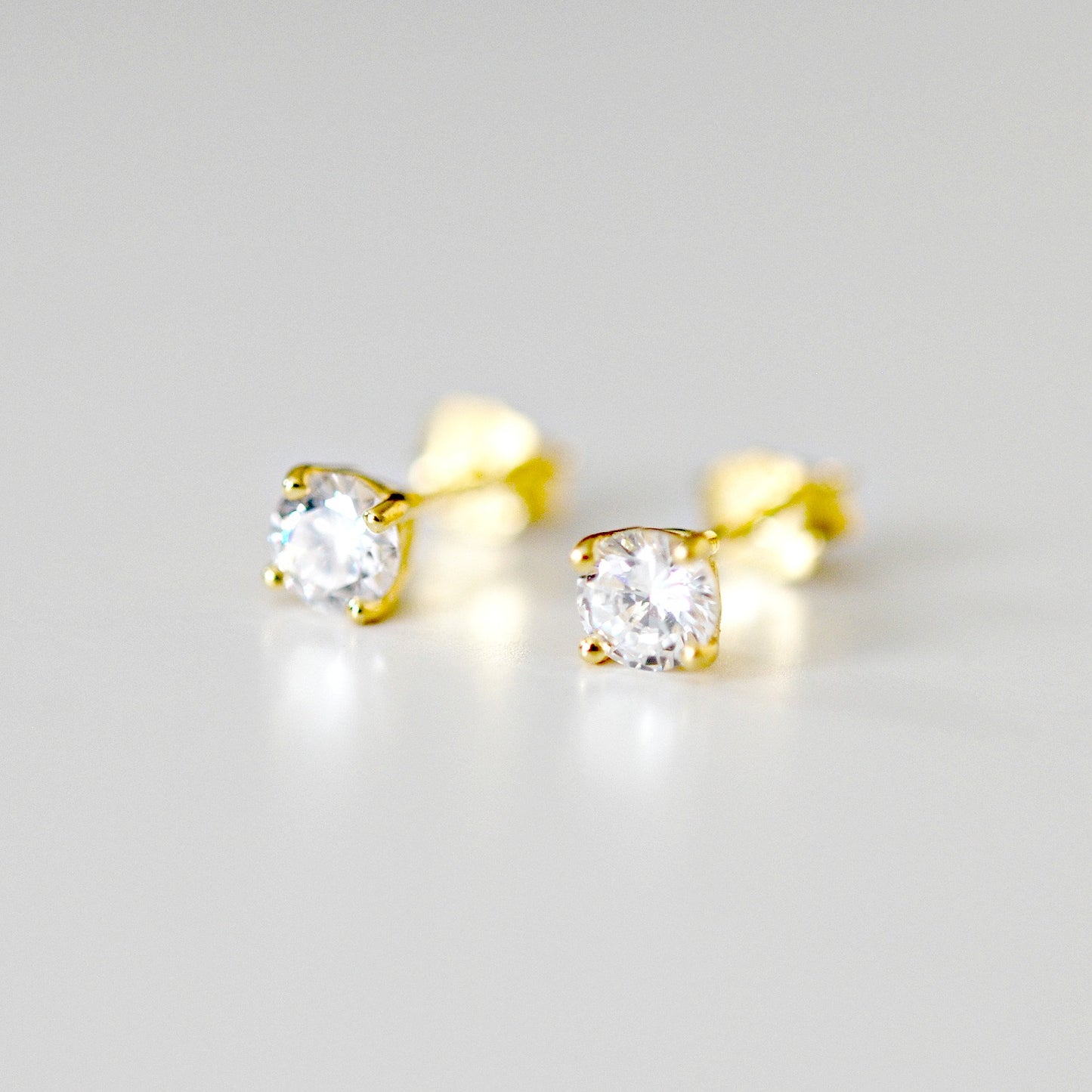 4mm clear cubic zirconia studs - gold