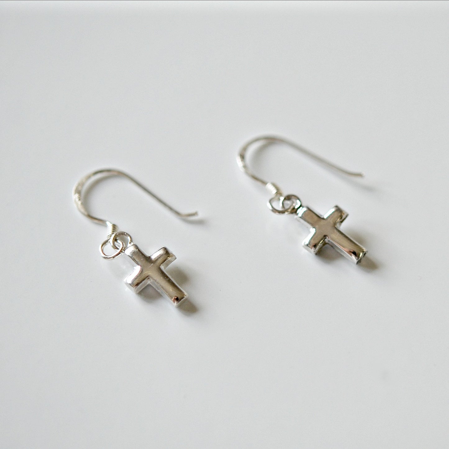 Tiny sterling silver cross earrings