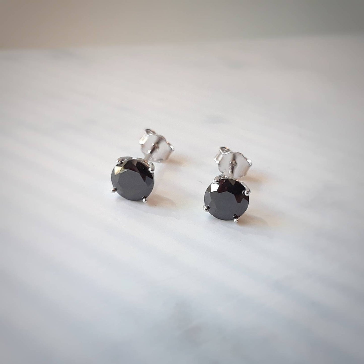 Minka round cz stud earrings - clear or black