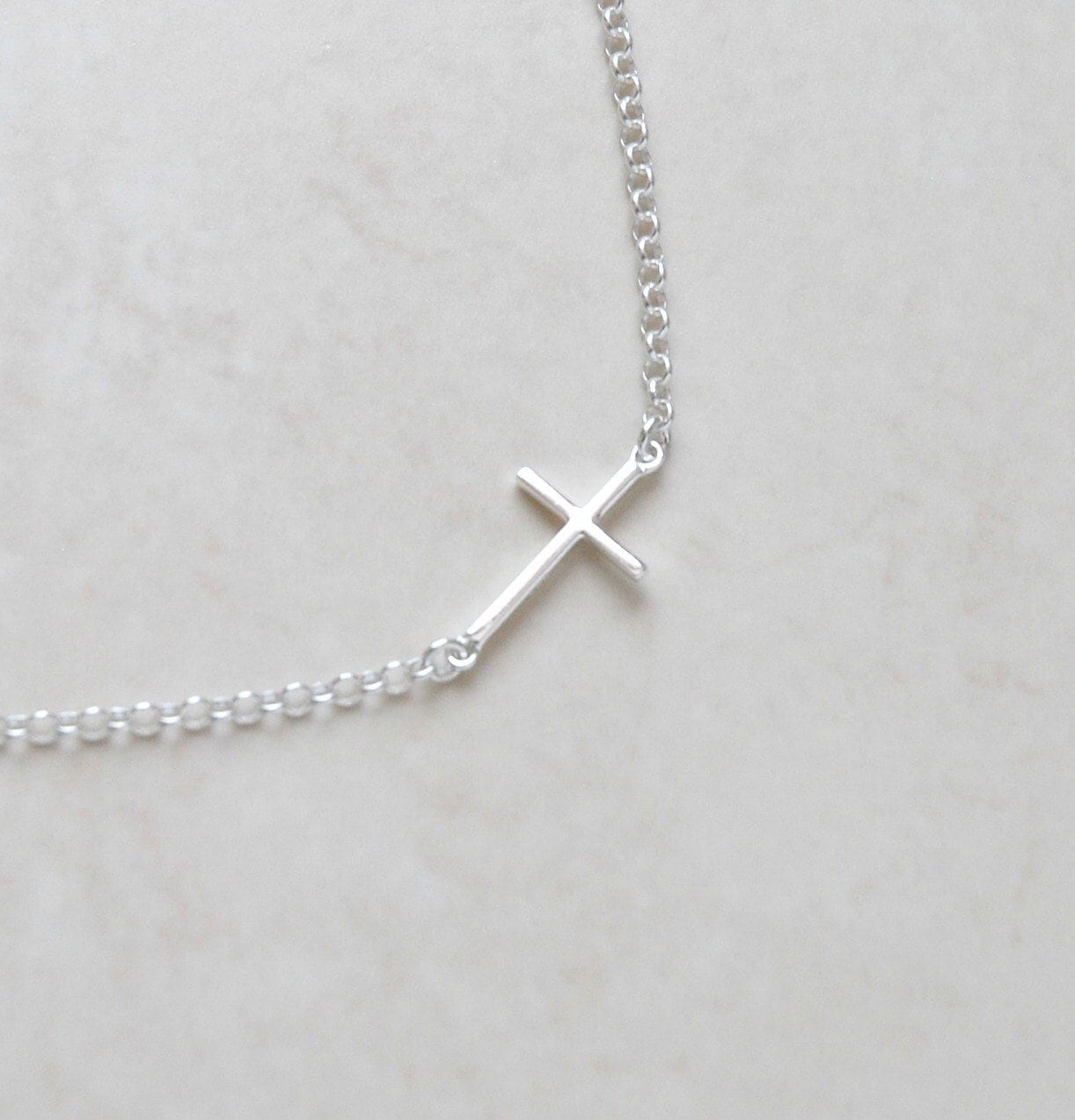 Silver sideways cross necklace