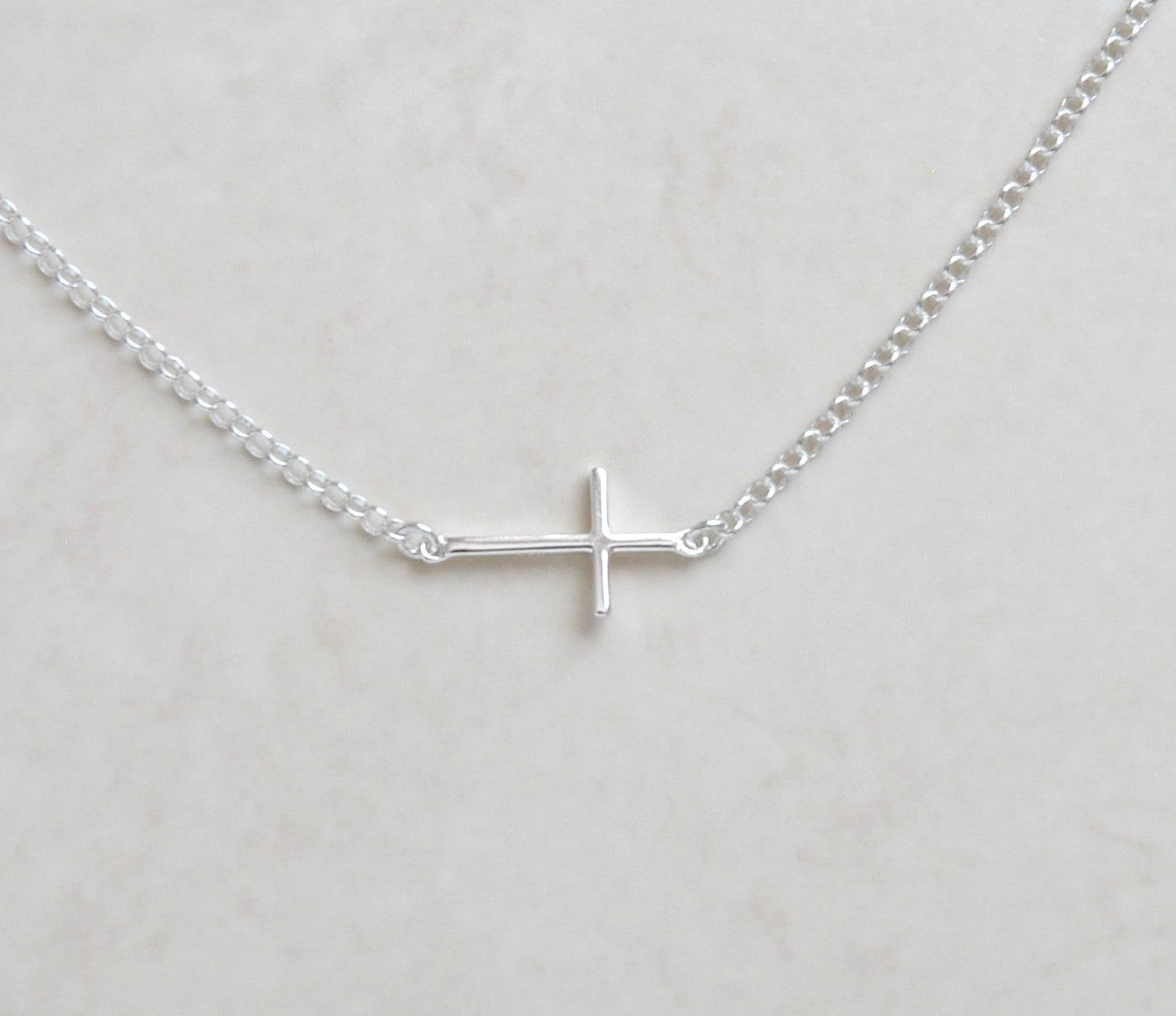 Silver sideways cross necklace